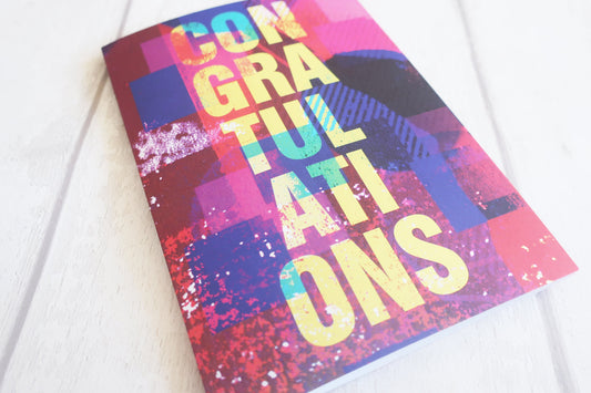 Colorful 'Congratulations' card with abstract design on a white background