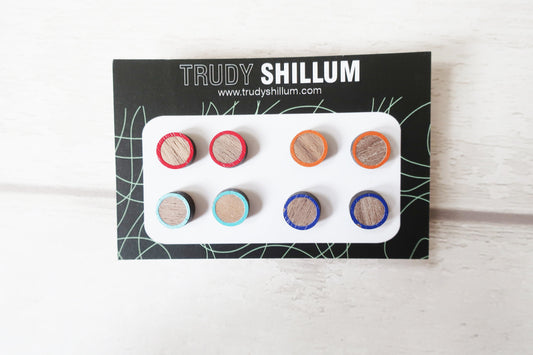 Set of earrings on a Trudy Shillum branded card with colorful earstuds.