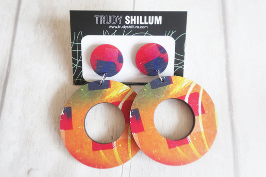 Colorful earrings on a white background with 'Trudy Shillum' packaging.