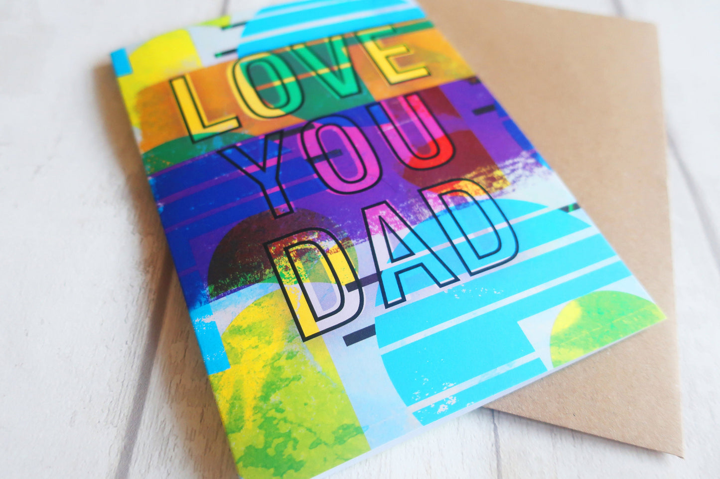 Colorful card with 'I Love You Dad' text on a white background