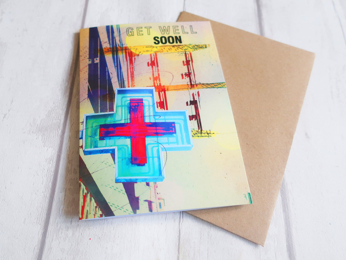 Get well soon card with colorful cross design on a white background