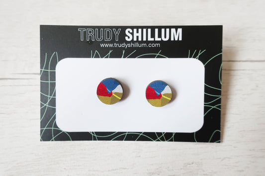 Colorful circular earrings on a Trudy Shillum branded card against a light background