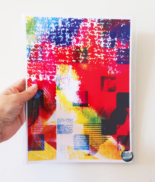 Colorful abstract art print held by a hand on a white background