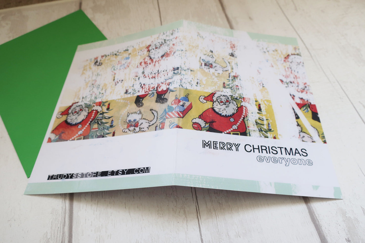 Christmas card with vintage Santa design on a wooden surface