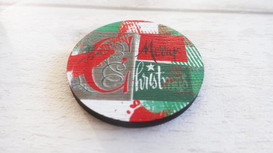 Round decorative badge with Christmas-themed design on a white surface
