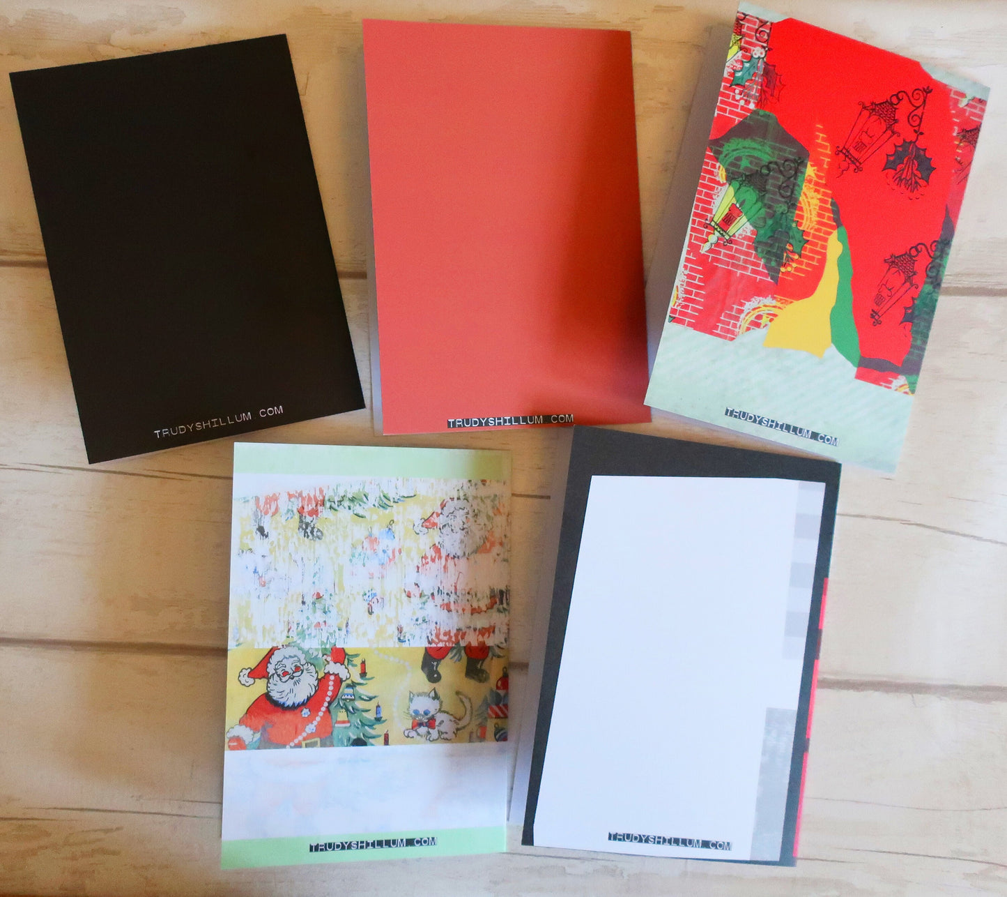 Collection of colorful greeting cards on a wooden surface