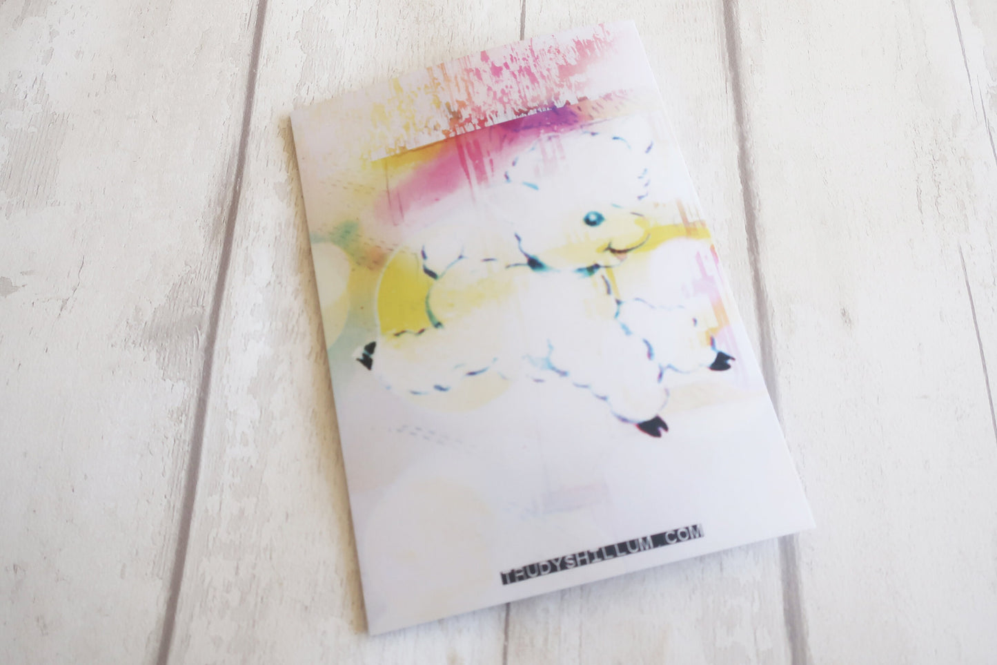 Colorful abstract card on a white surface