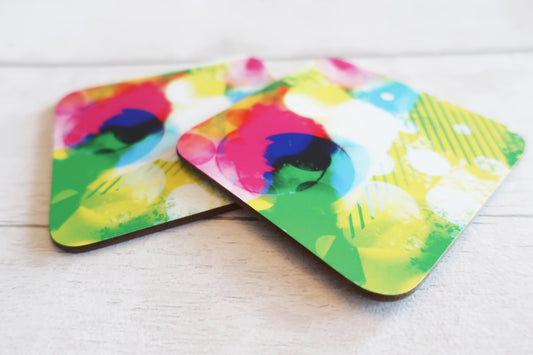 Colorful abstract design coasters on a white surface