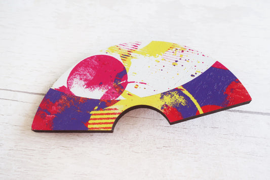 Colorful abstract design hairclip on a white background
