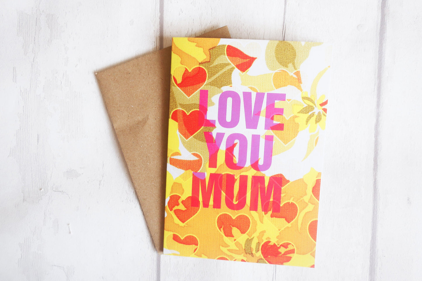 Greeting card with 'Love You Mum' text and floral design on a white background