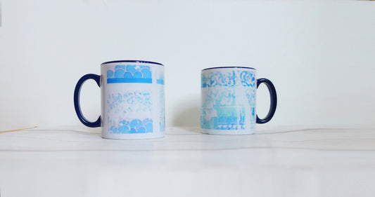 Two mugs with blue and white patterns on a white background