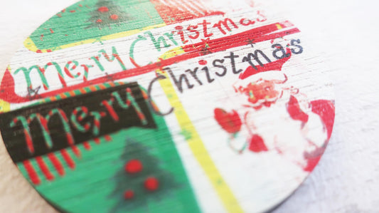 Christmas-themed badge with 'Merry Christmas' text on a white background.