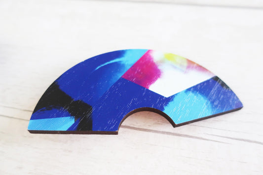 Colorful fan-shaped hairclip on a white background