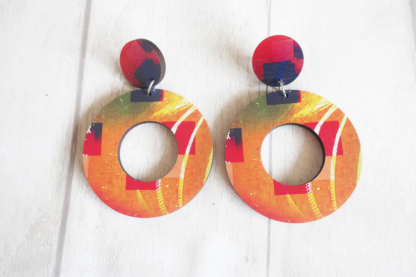 Colorful hoop earrings on a white background