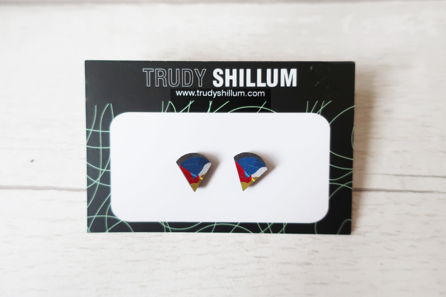 Trudy Shillum earrings on a branded card with a white background