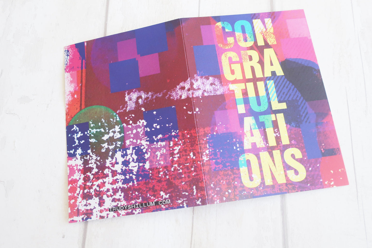 Colorful greeting card with 'Congratulations' text on a white background