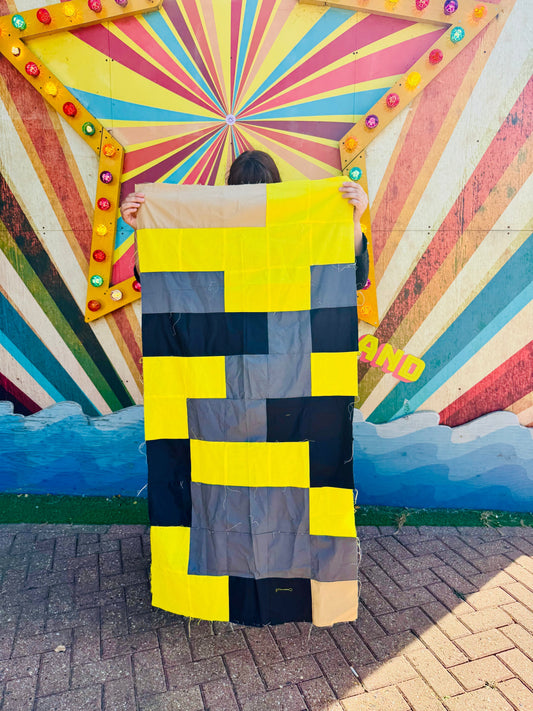 Trudy holding her 50th birthday mental health temperature quilt in Margate