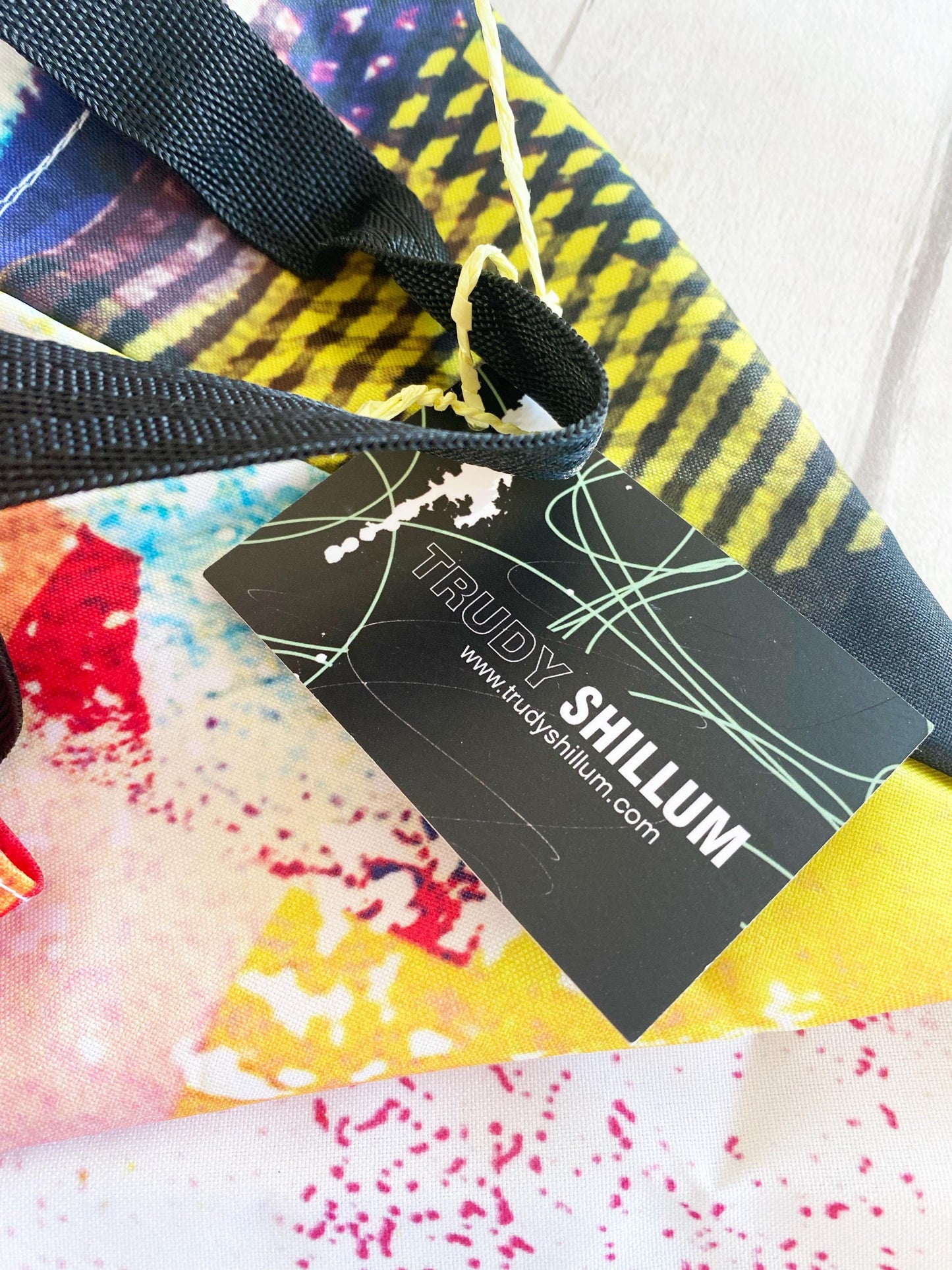 Colorful fabric with a black tag displaying 'Trudy Shillum' branding.