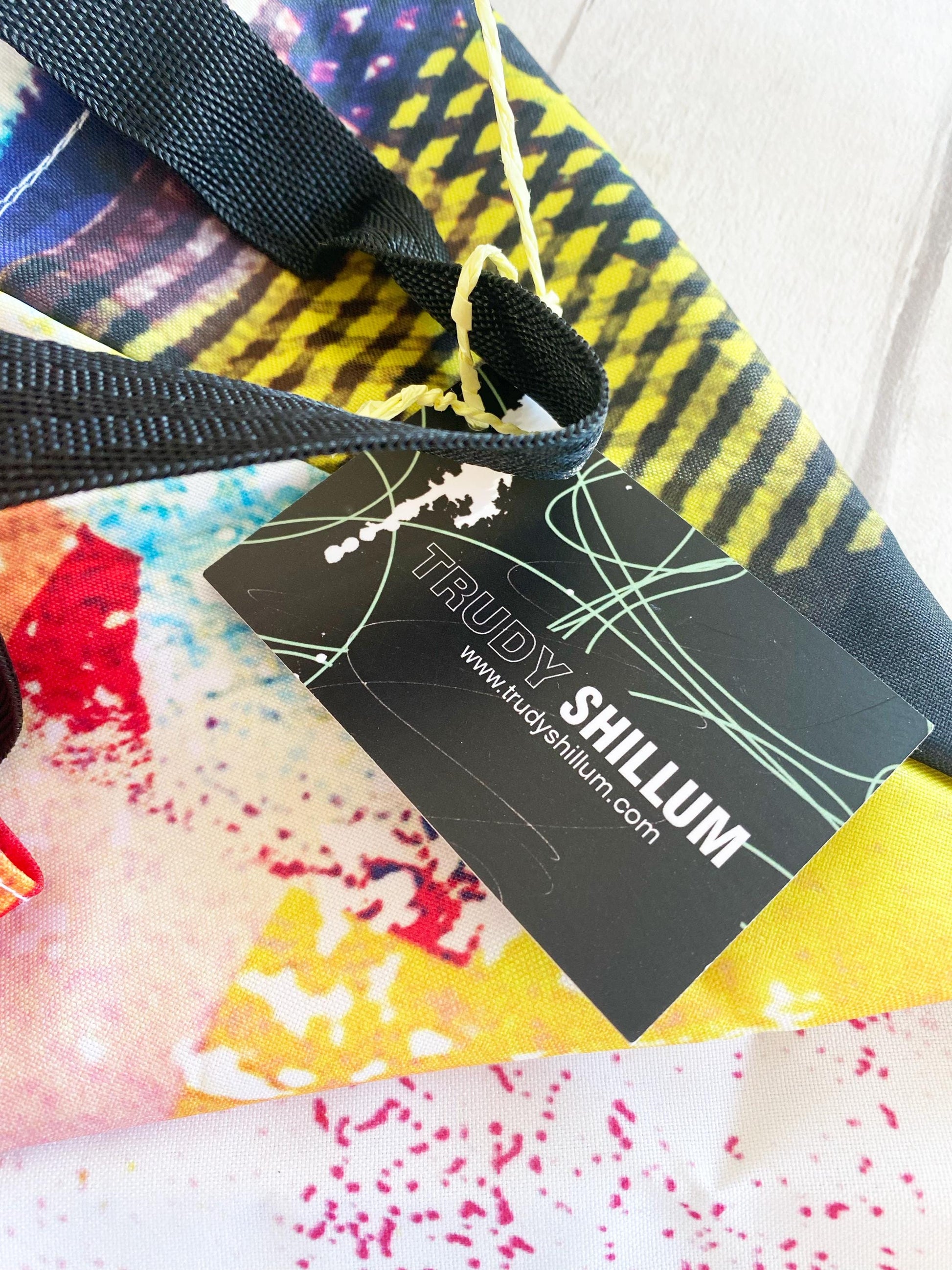 Colorful fabric with a black tag displaying 'Trudy Shillum' branding.
