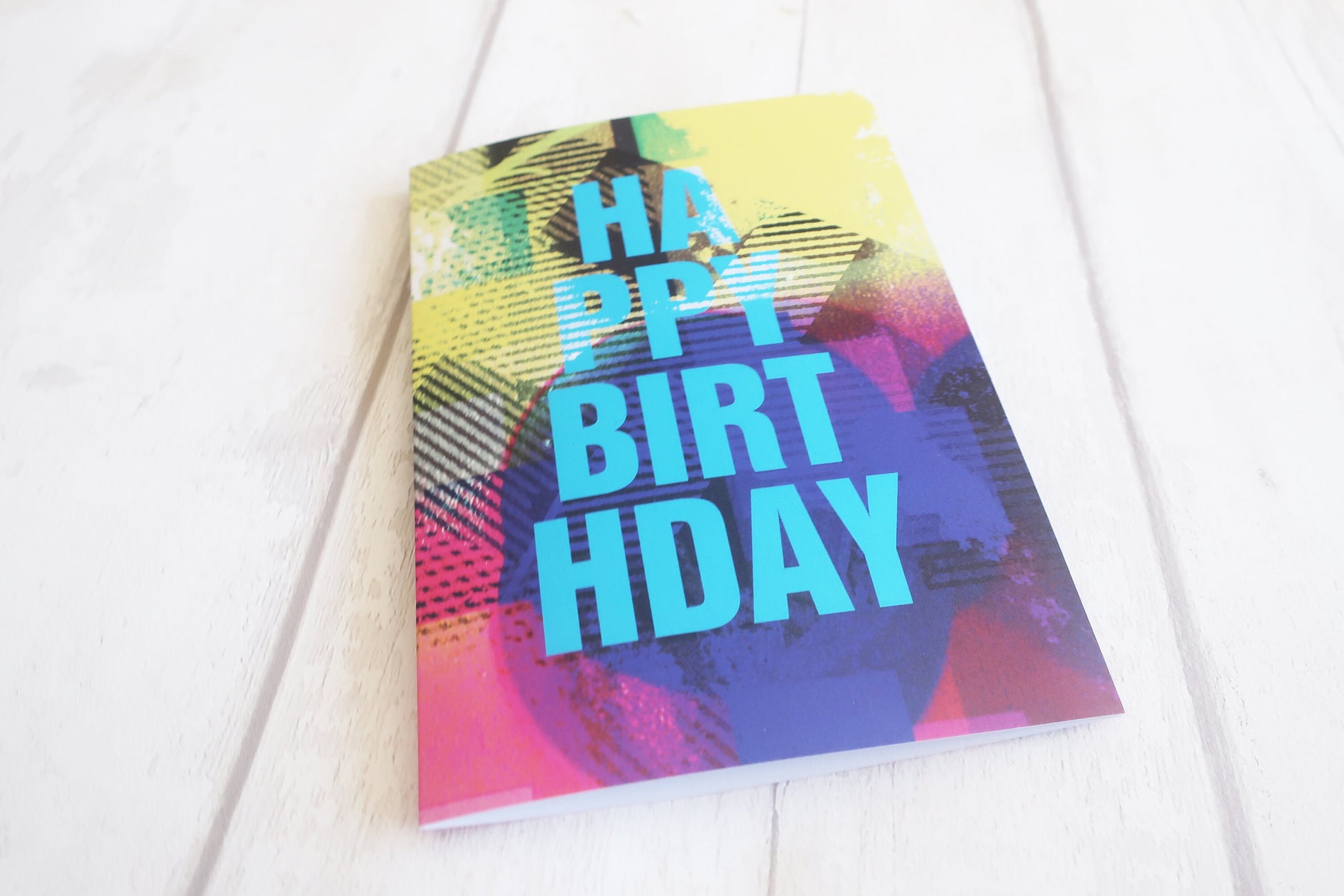 Colorful birthday card with 'Happy Birthday' text on a white background