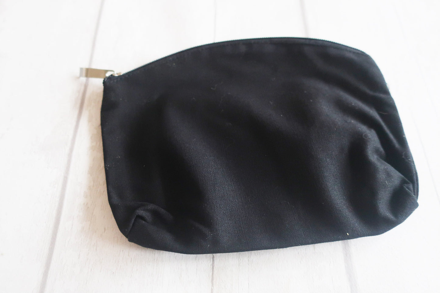 Black clutch bag on a white background