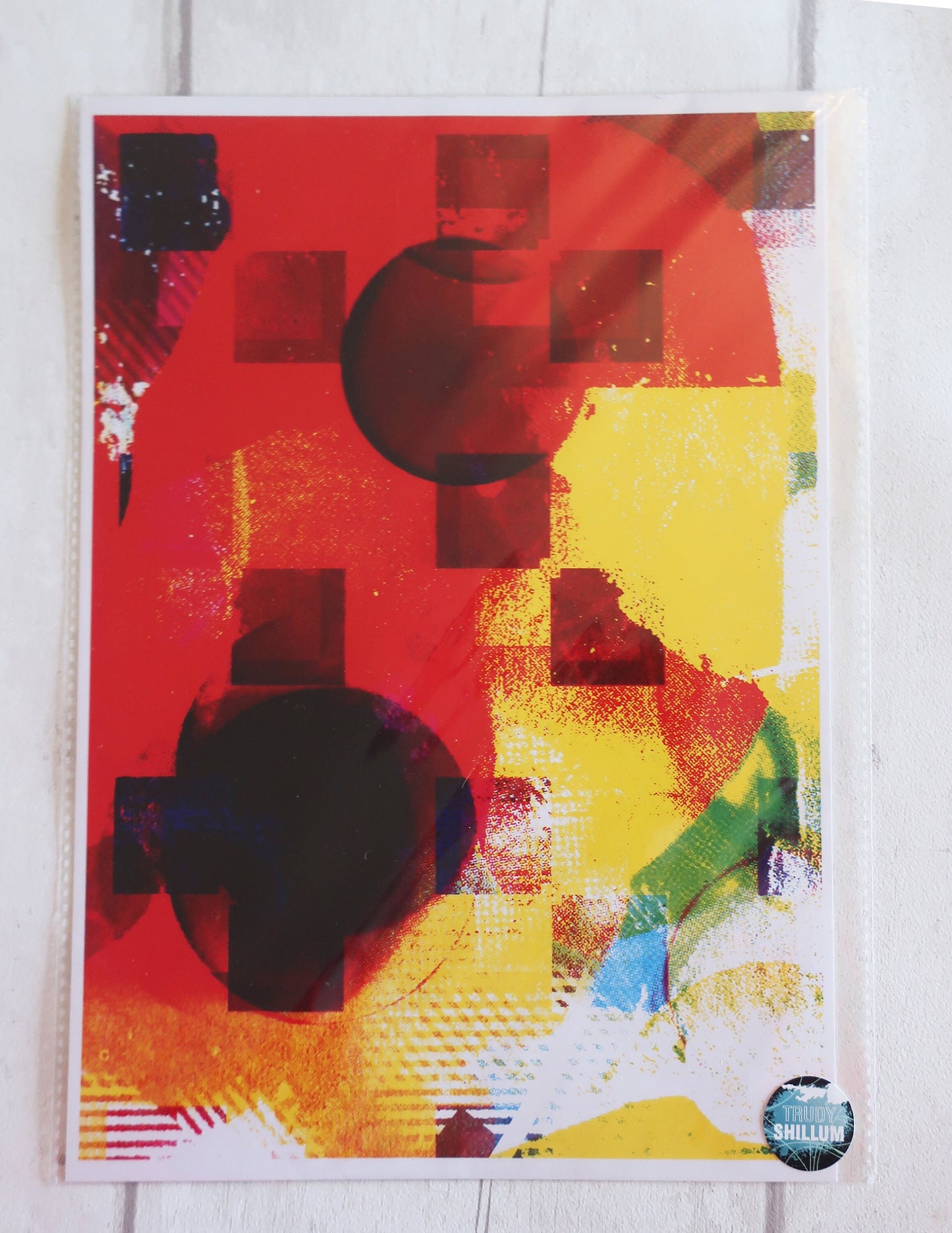 Abstract art print with red, yellow, and black colors on a white background