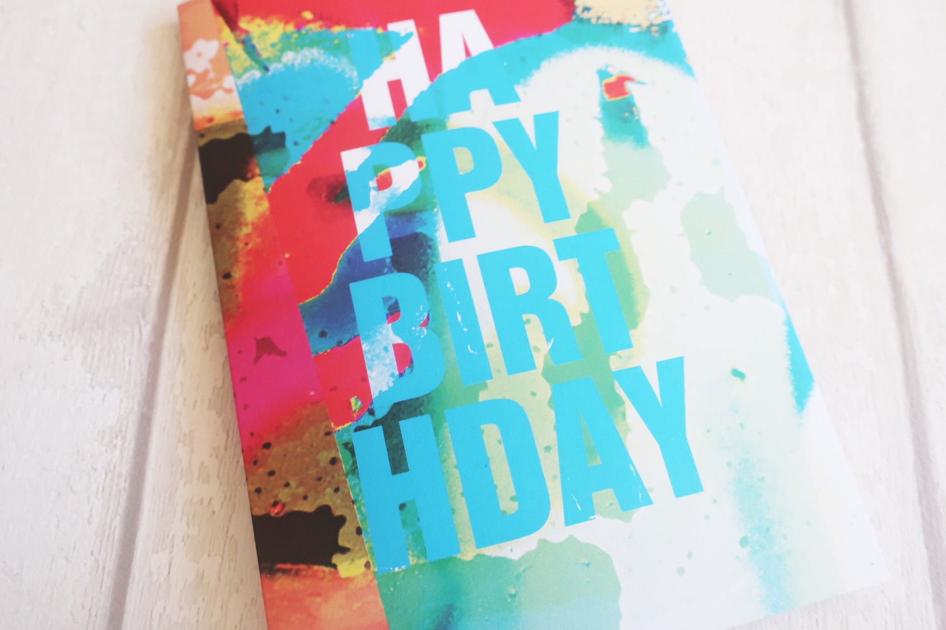 Colorful birthday card with watercolor design on a white background