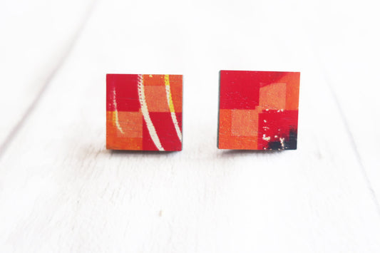 Colorful square stud earrings on a white background