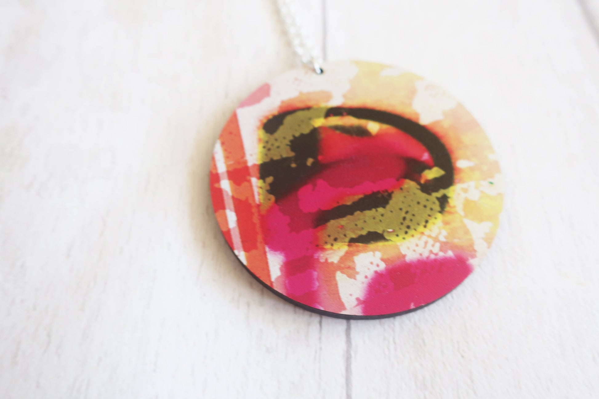 Colorful round pendant on a white background