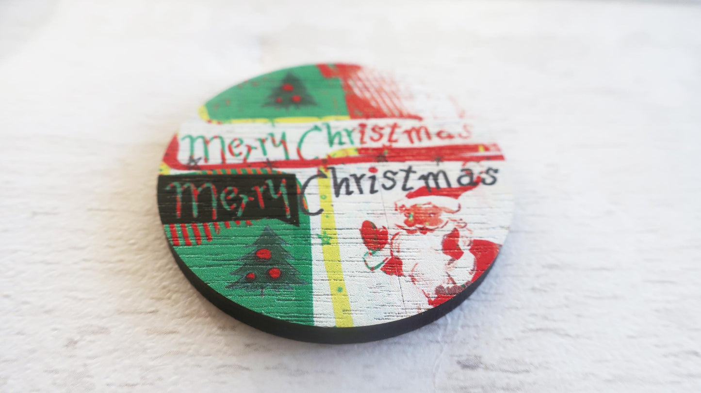 Round wooden badge with 'Merry Christmas' text and festive designs on a white background
