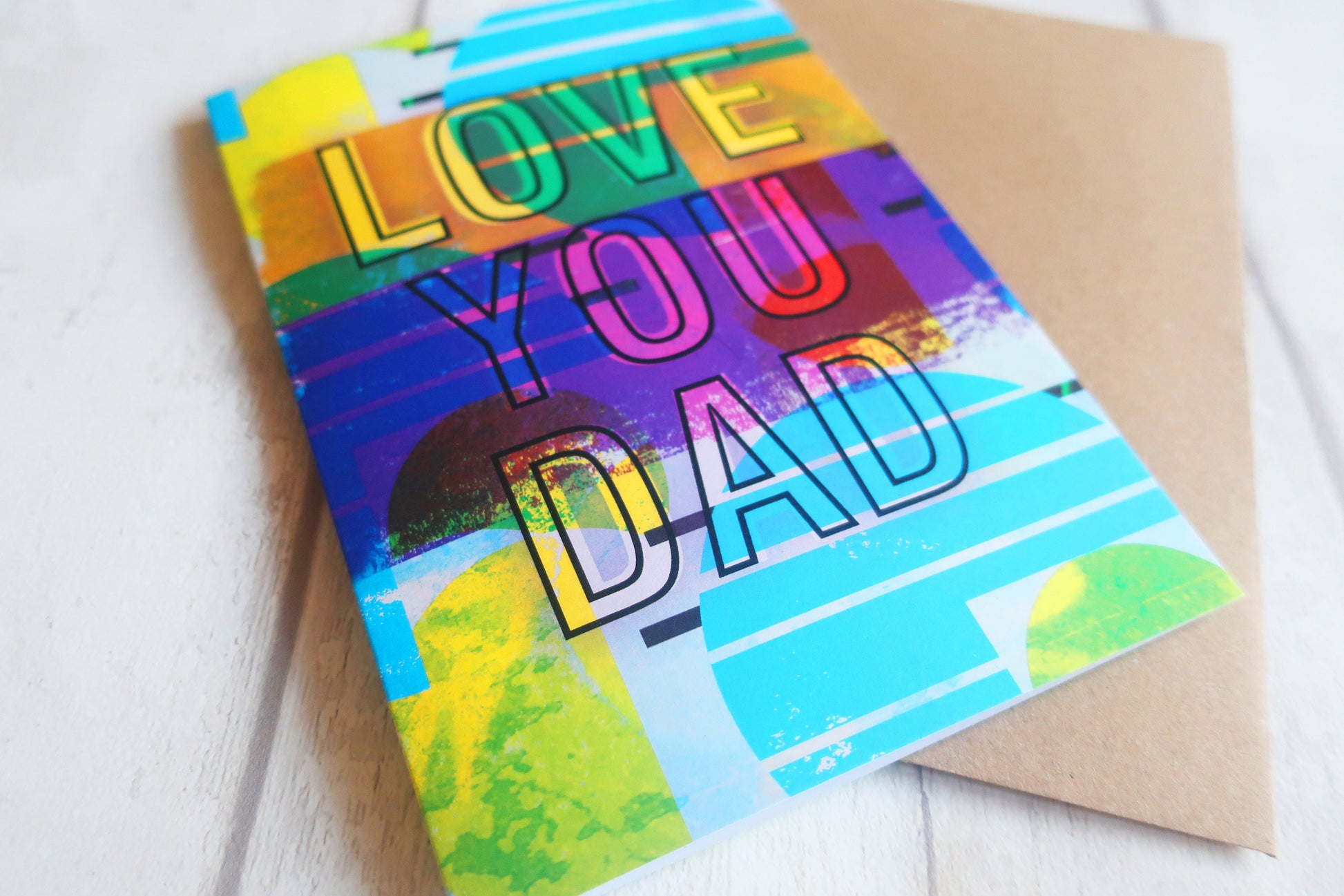Colorful card with 'I Love You Dad' text on a white background