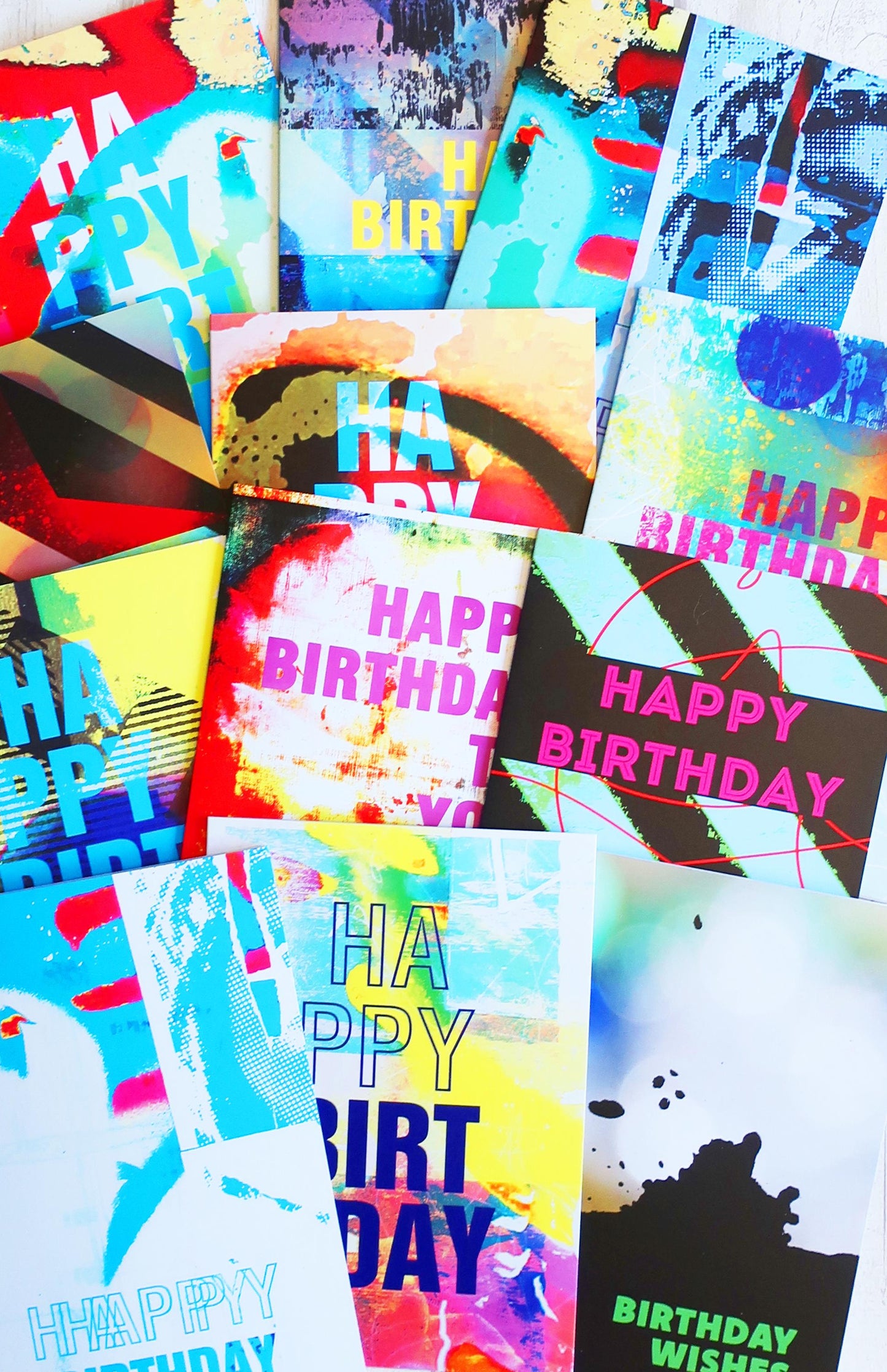 Collection of colorful 'Happy Birthday' greeting cards with various designs.