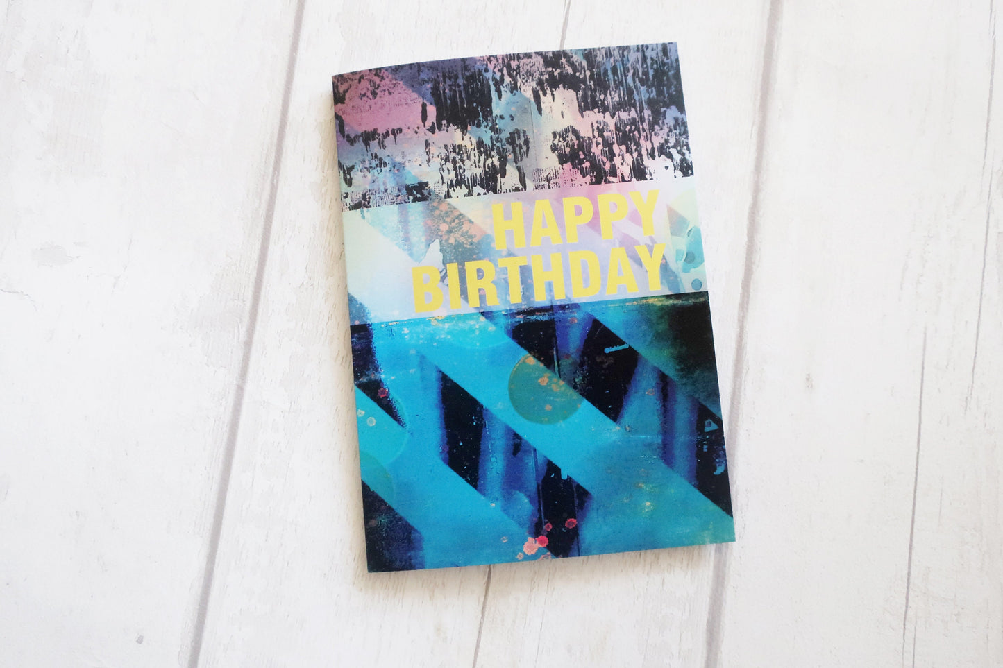 Colorful birthday card with abstract design on a white background