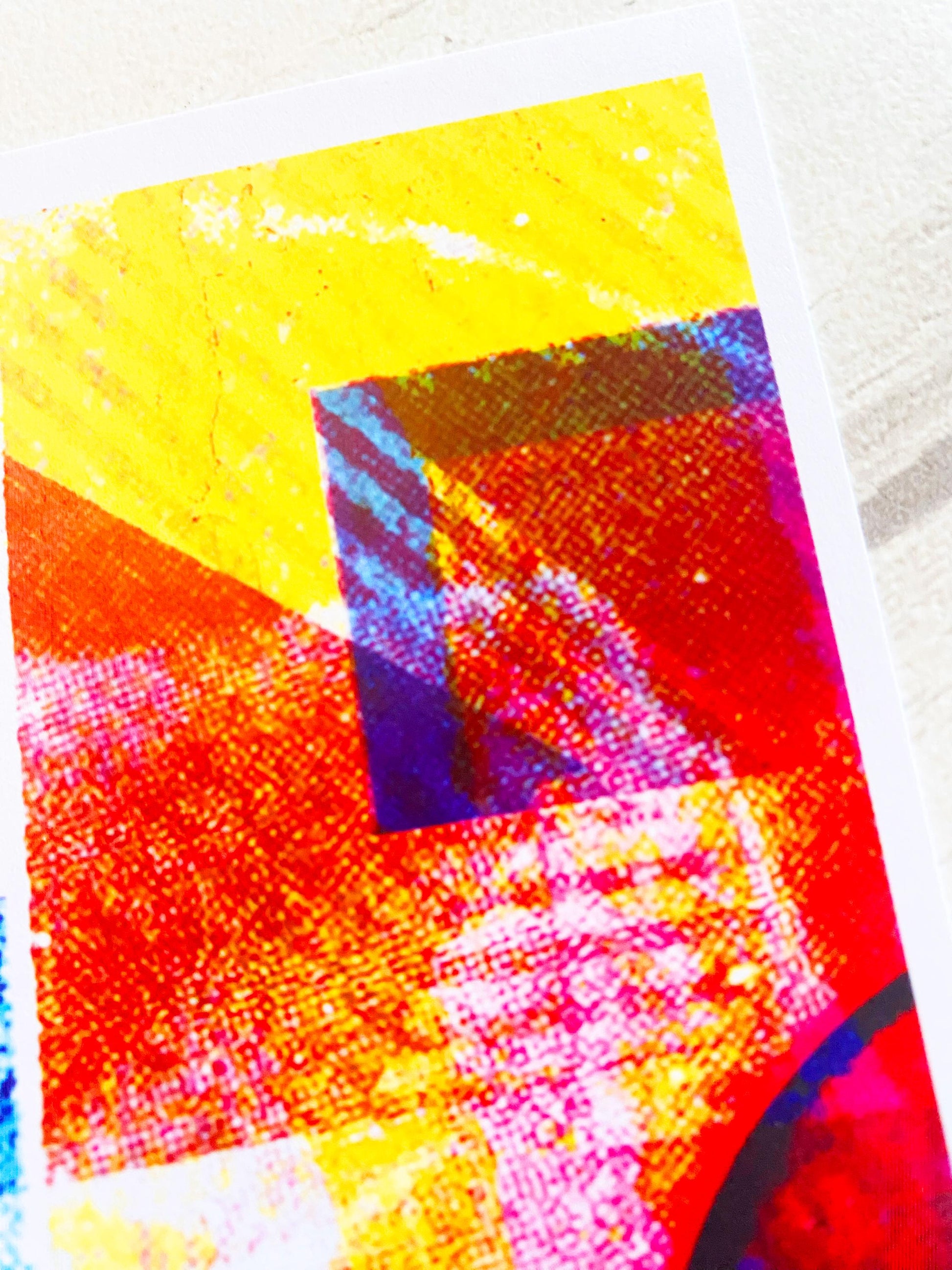 Colorful abstract art piece on a textured surface