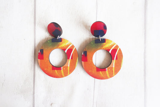 Colorful circular earrings on a white background