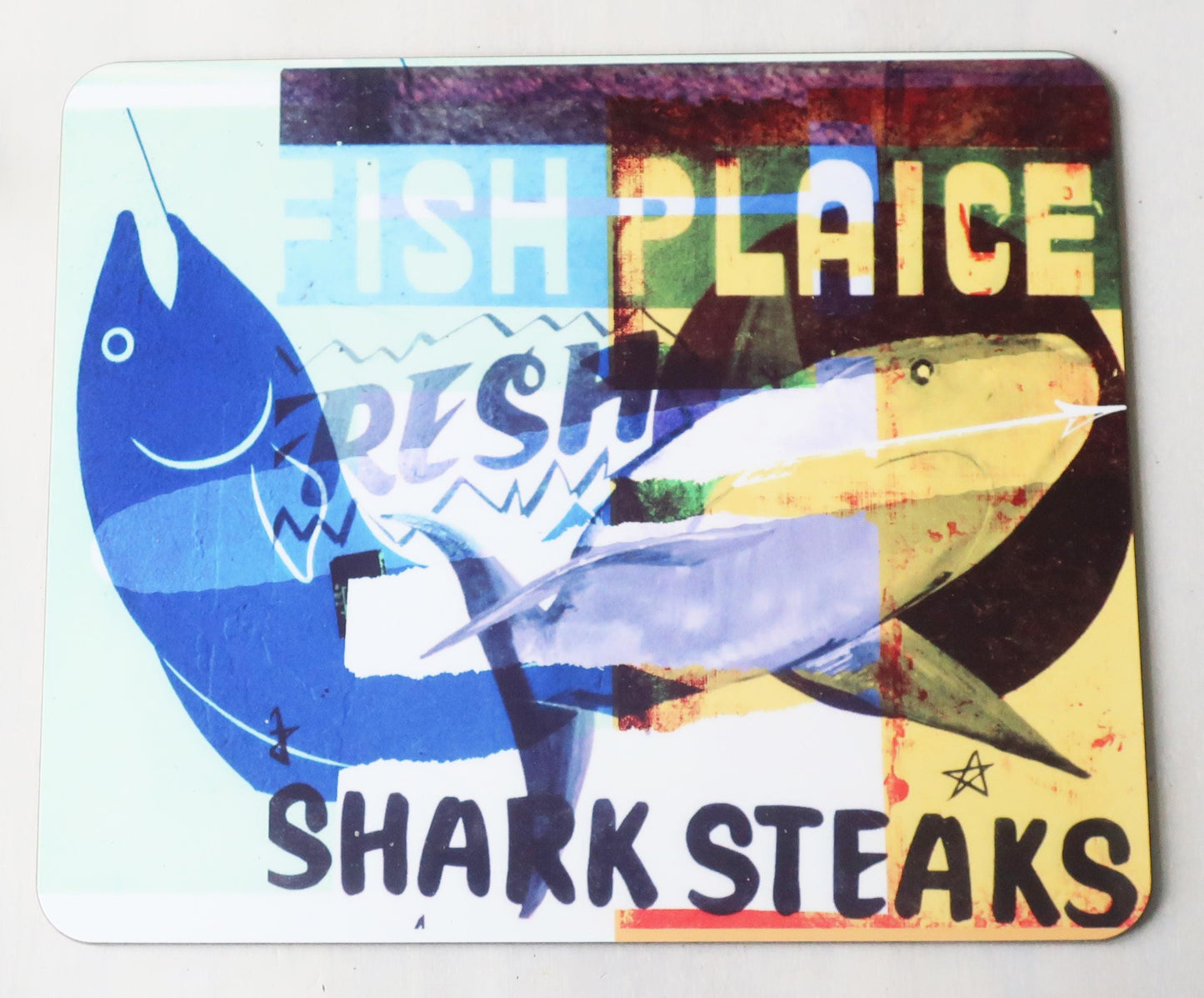 Colorful placemat with fish illustrations and text on a white background