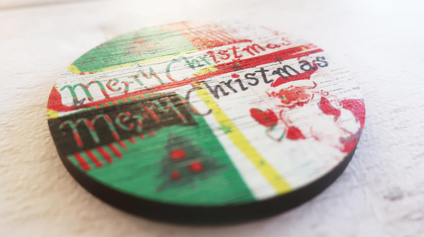 Round Christmas-themed badge with colorful design on a white surface