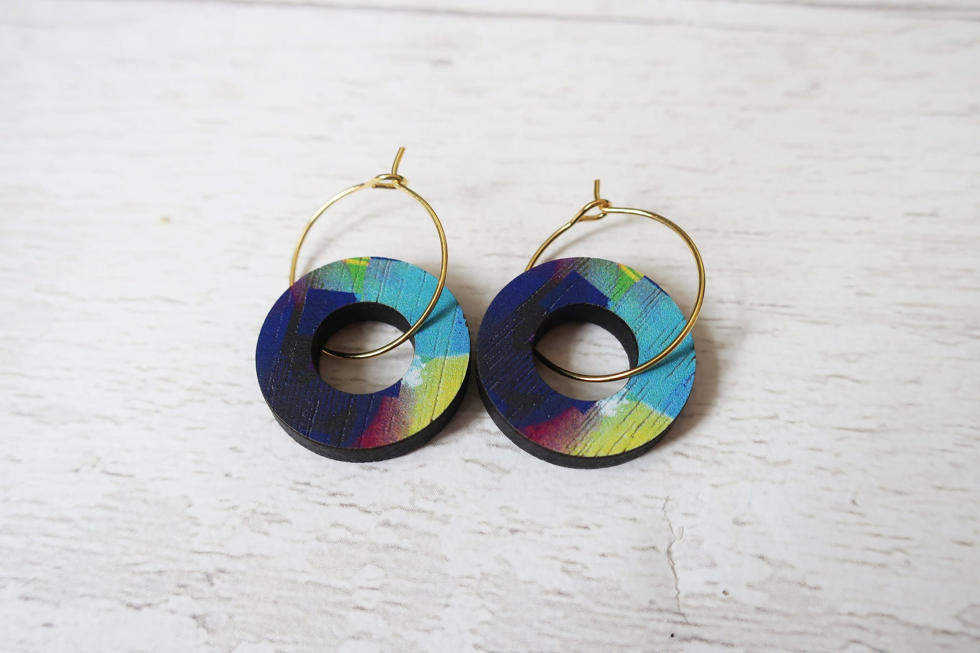 Colorful hoop earrings on a white background