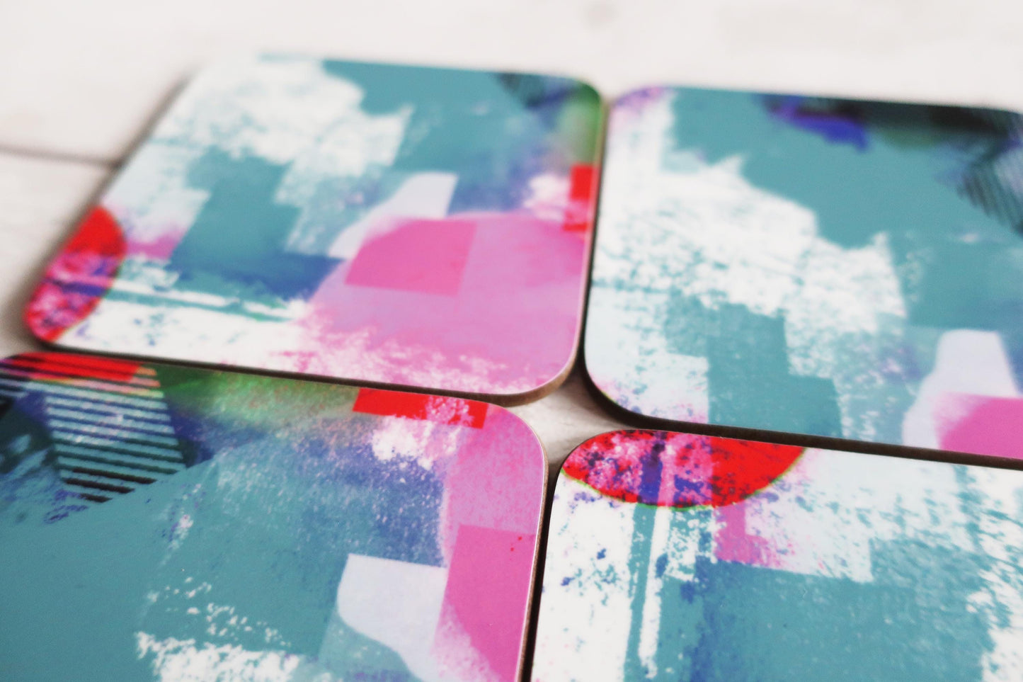 Set of colorful abstract coasters on a white surface