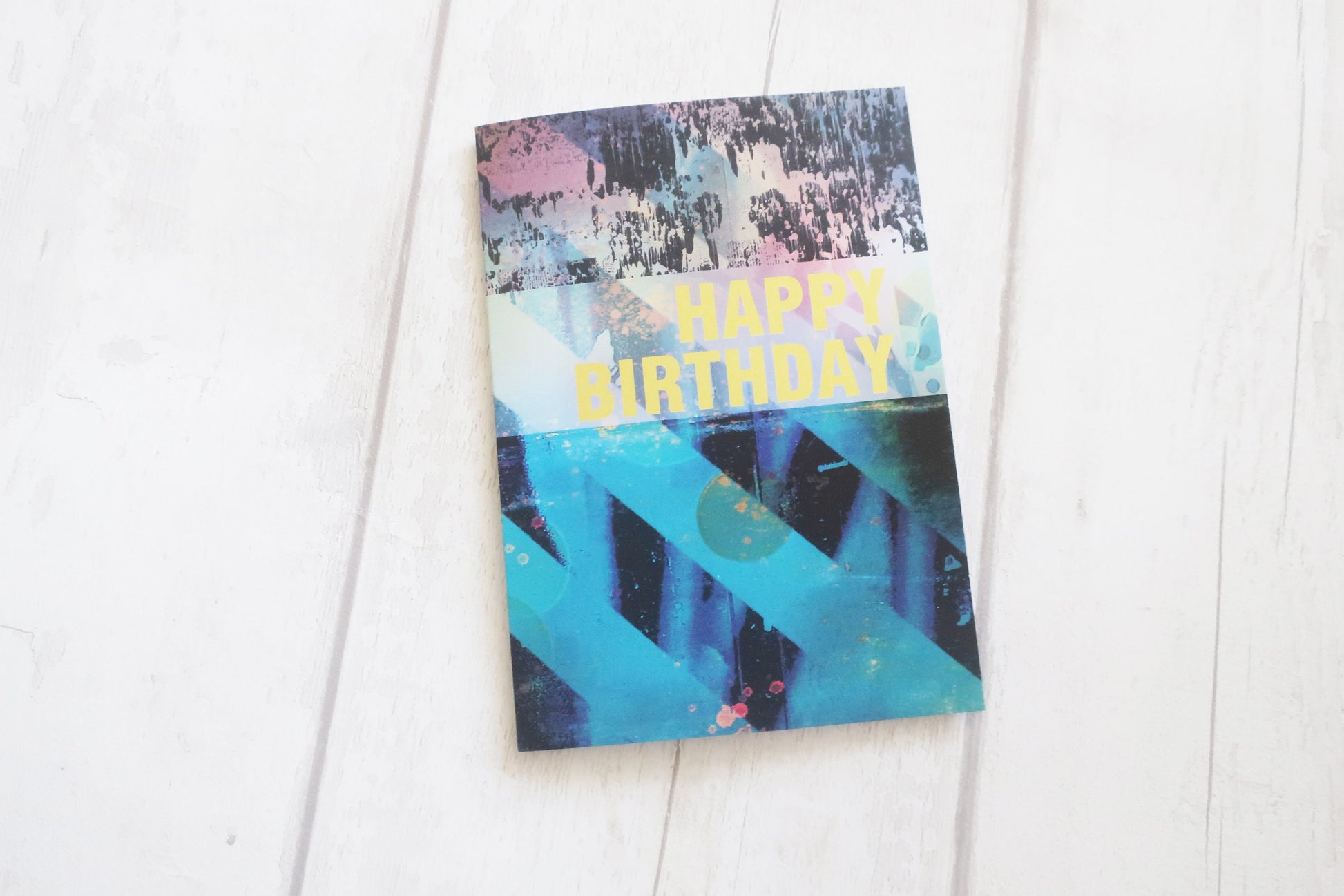 Colorful birthday card with abstract design on a white background