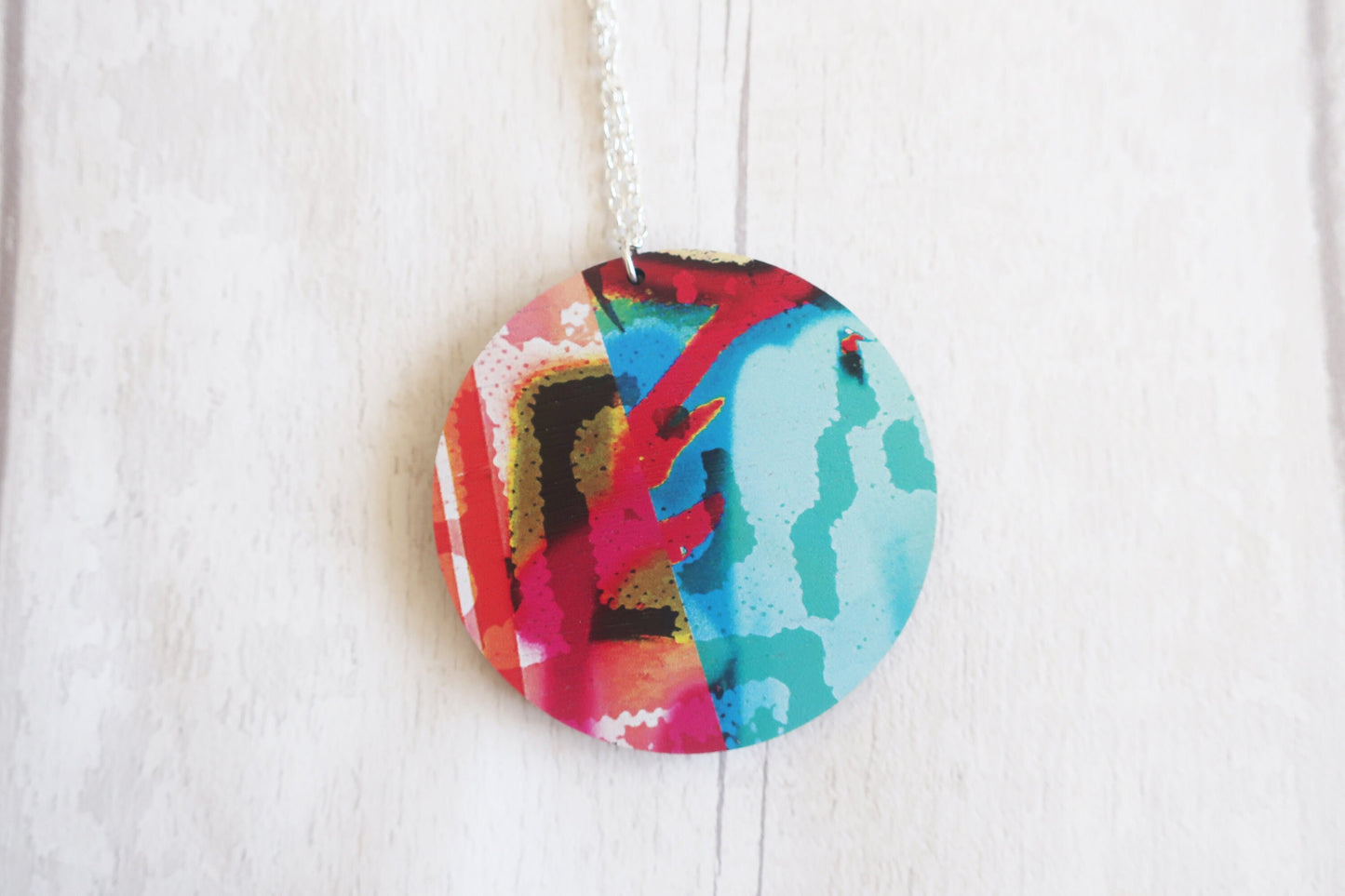 Colorful circular pendant on a white background