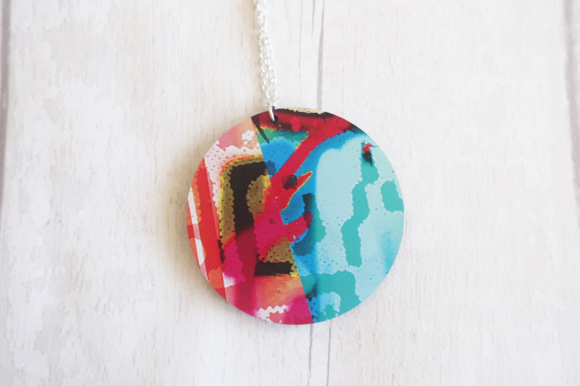 Colorful circular pendant on a white background