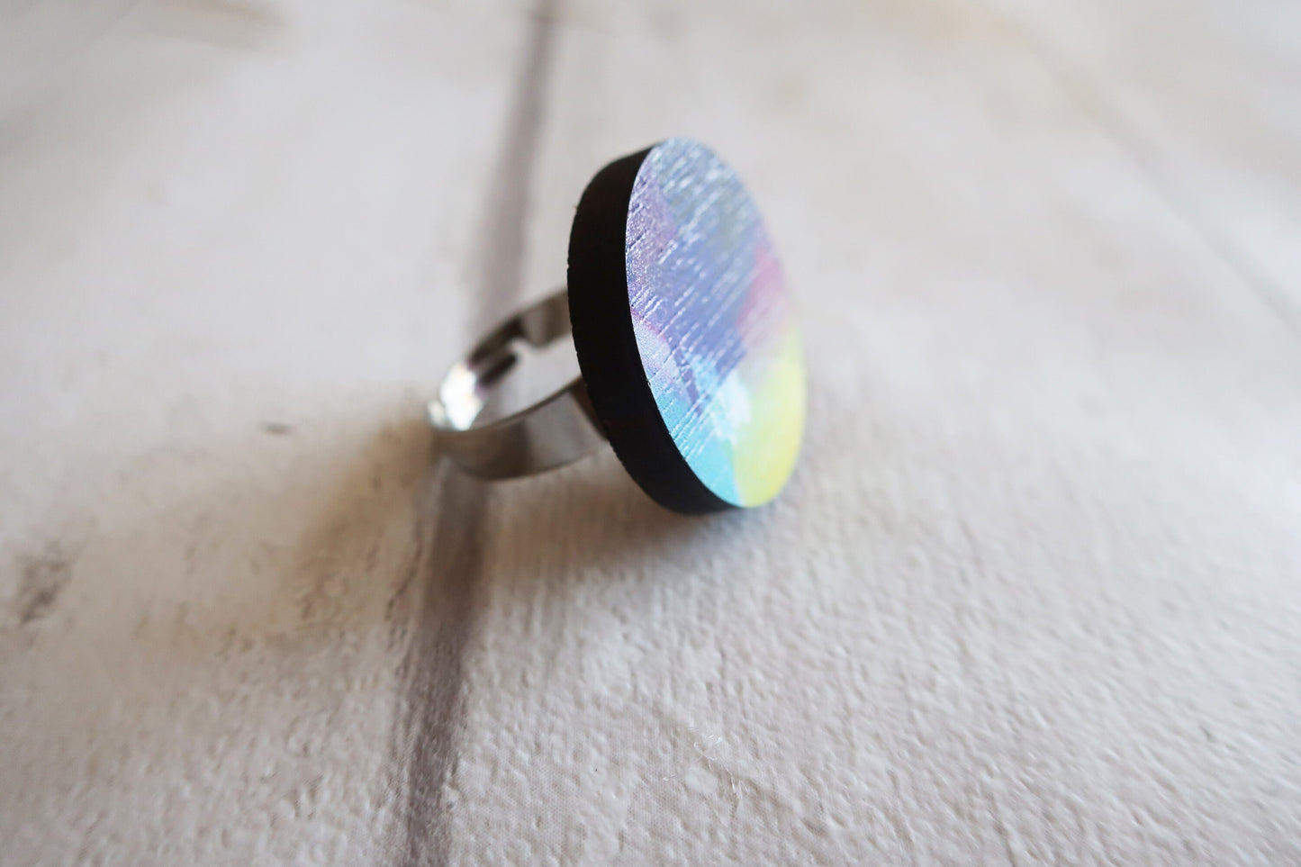 Ring with a multicolored pattern on a light background