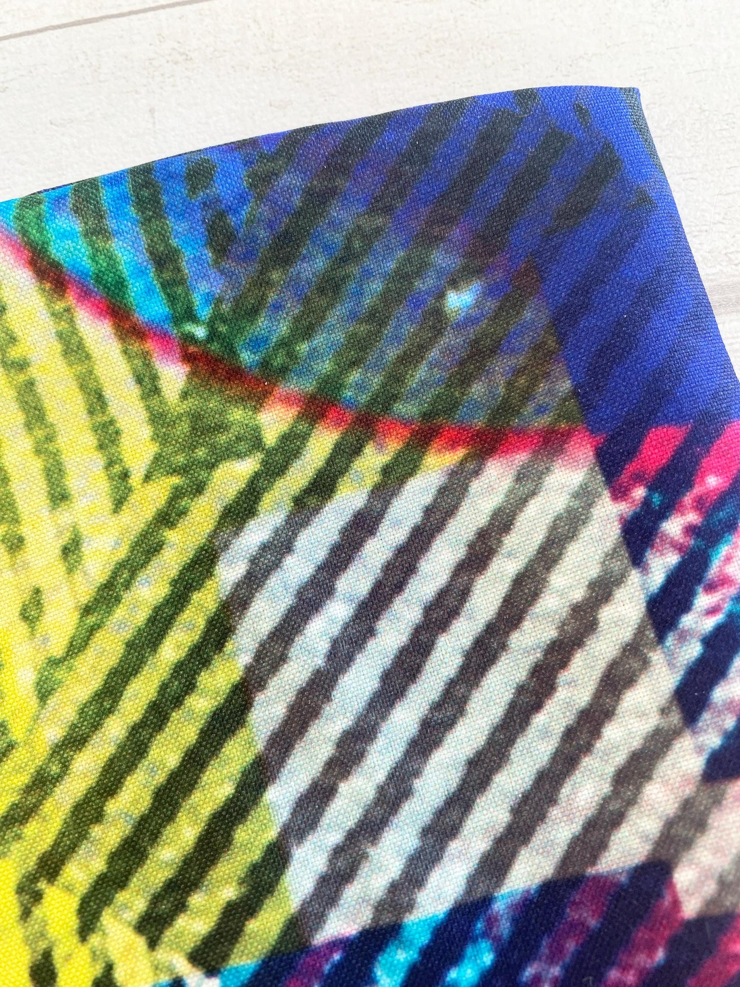 Colorful abstract pattern fabric on a textured surface