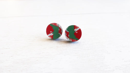 Round earrings with red and green pattern on a white background