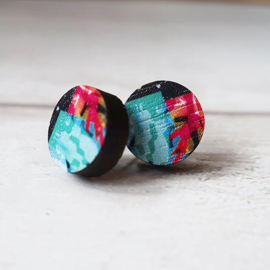 Colorful abstract patterned earrings on a light background