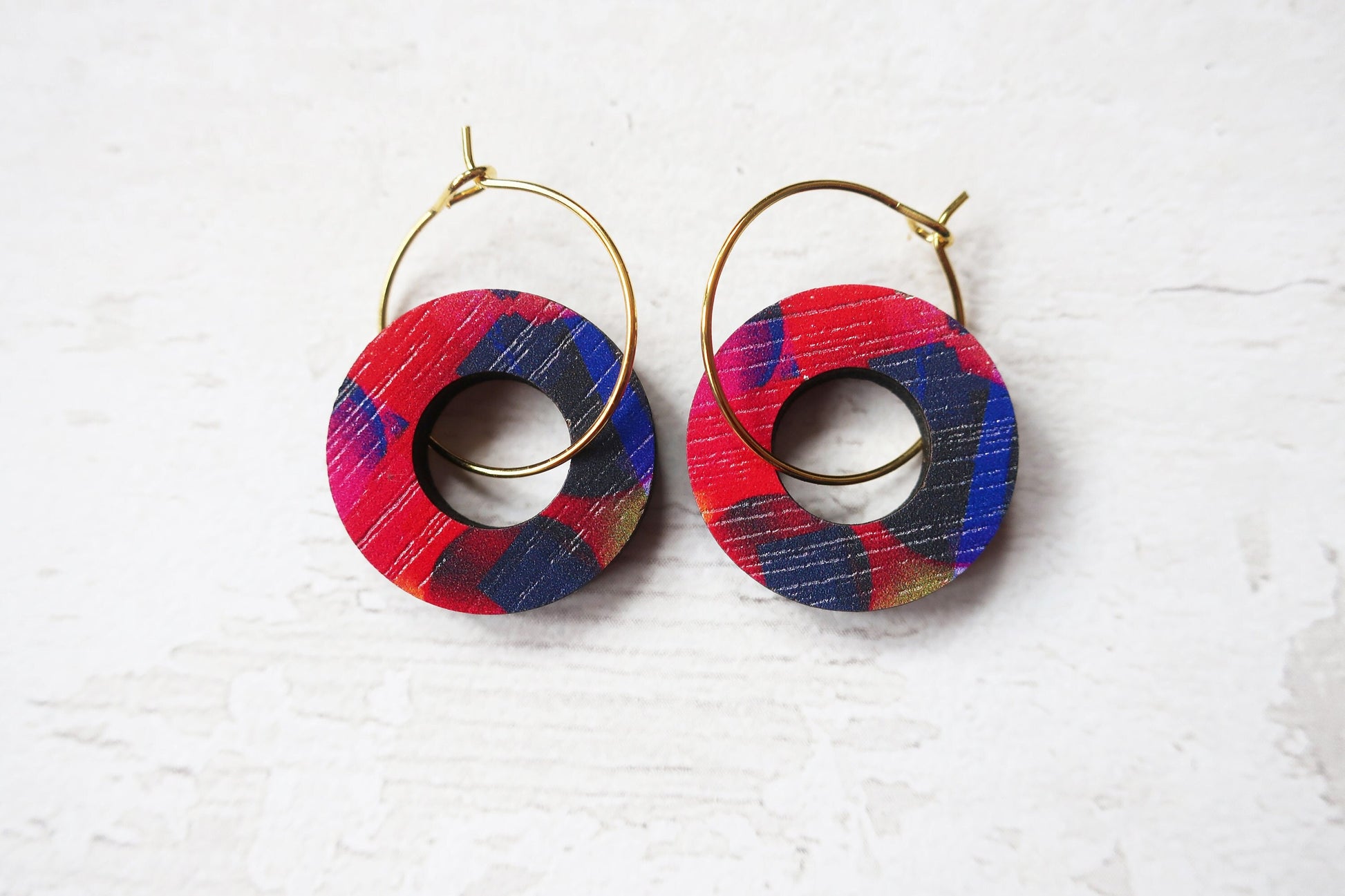 Colorful hoop earrings on a white background