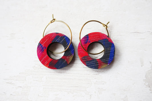 Colorful hoop earrings on a white background