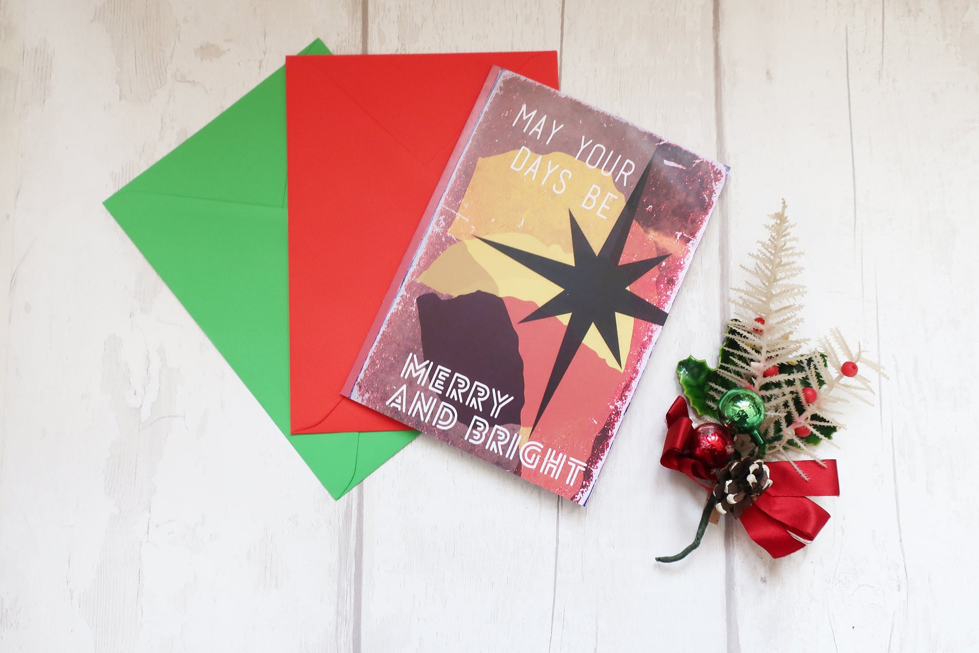Christmas card with decorative elements on a wooden surface
