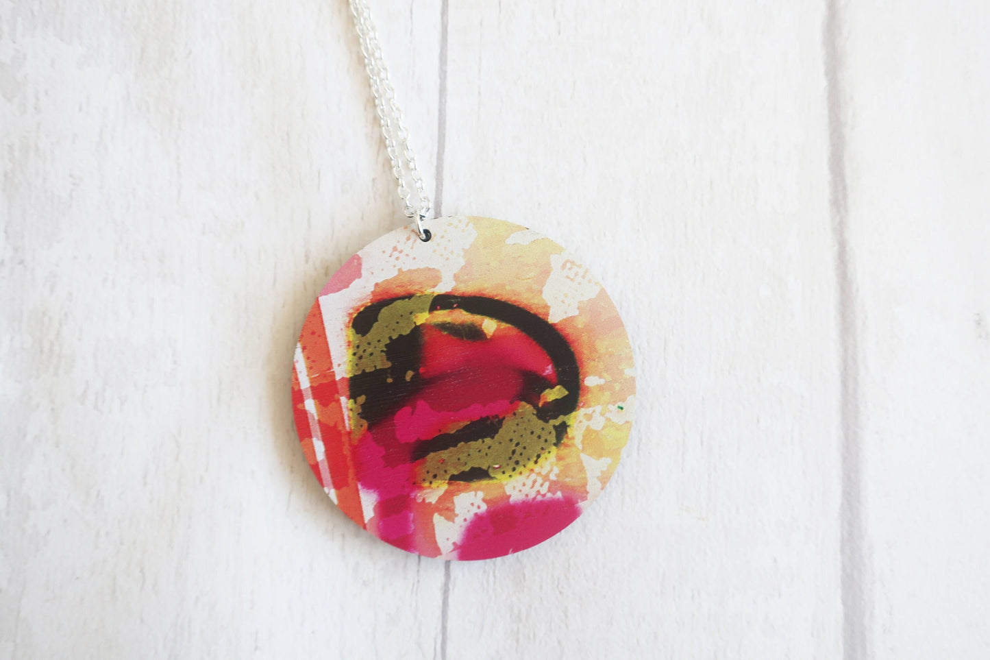 Colorful circular pendant on a white background